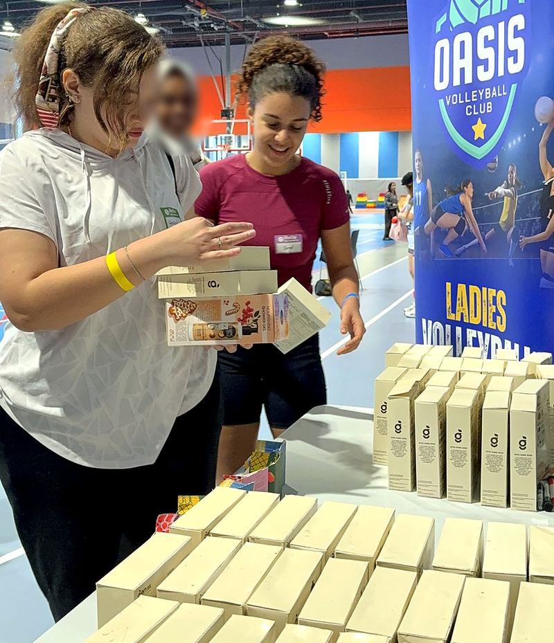 Players collecting partner gifts at the Oasis ladies volleyball afternoon